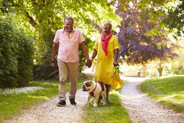 Black couple walking dog