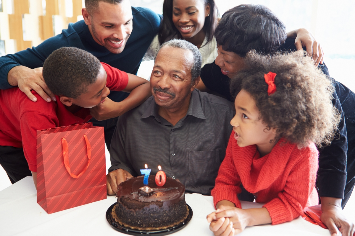 Black senior man with birthday cake